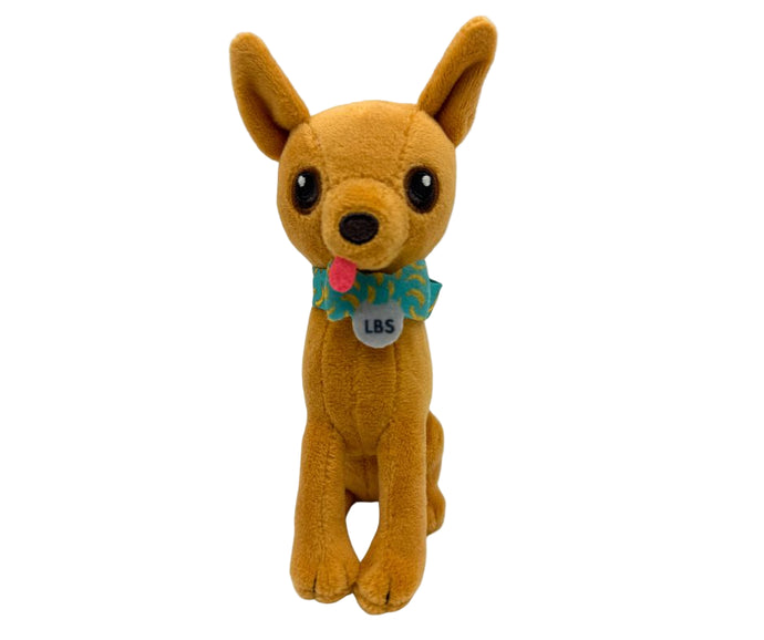 Plush dog toy with a tag on a white background